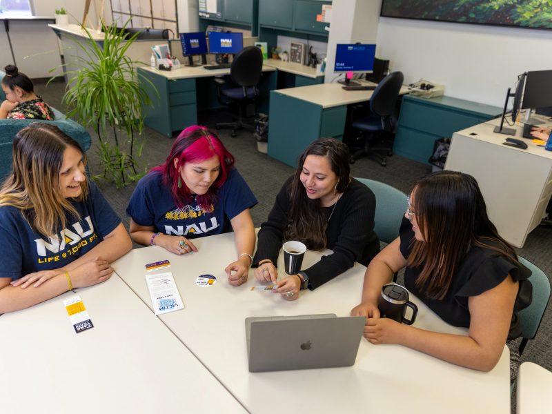 Staff in the Care office collaborate at a round table